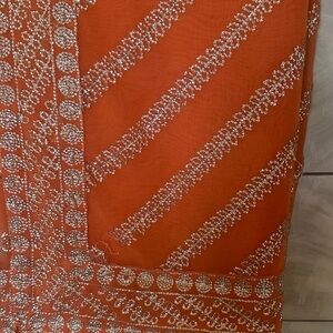 Vibrant Orange Fabric with Silver Detailing